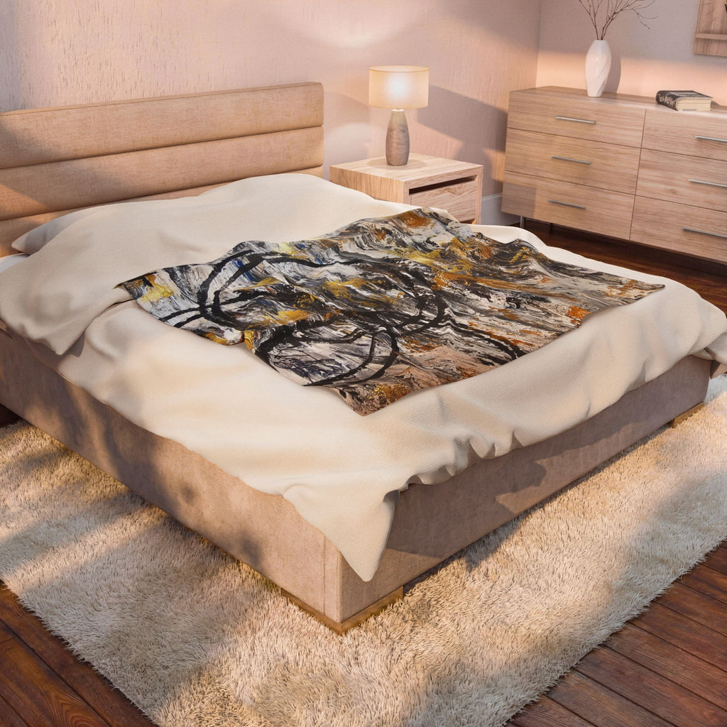 Velveteen plush blanket with abstract gold and charcoal circles on off-white