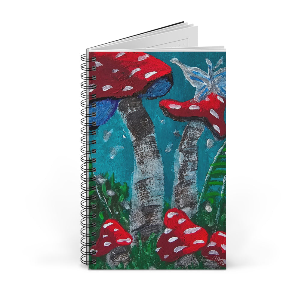 Stacked spiral notebook set with red toadstool forest cover art and visible page edges.