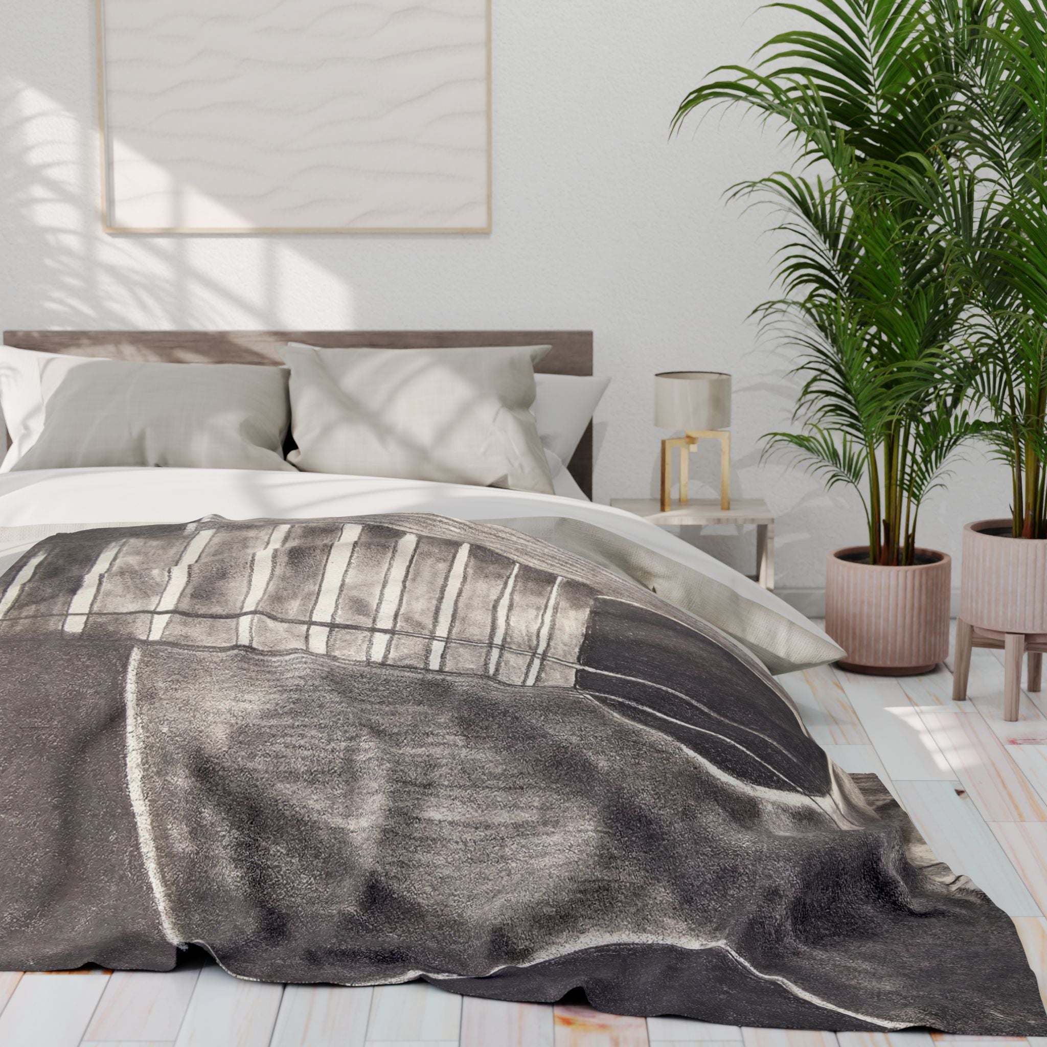 Gray fleece blanket on bed with acoustic guitar graphic across top