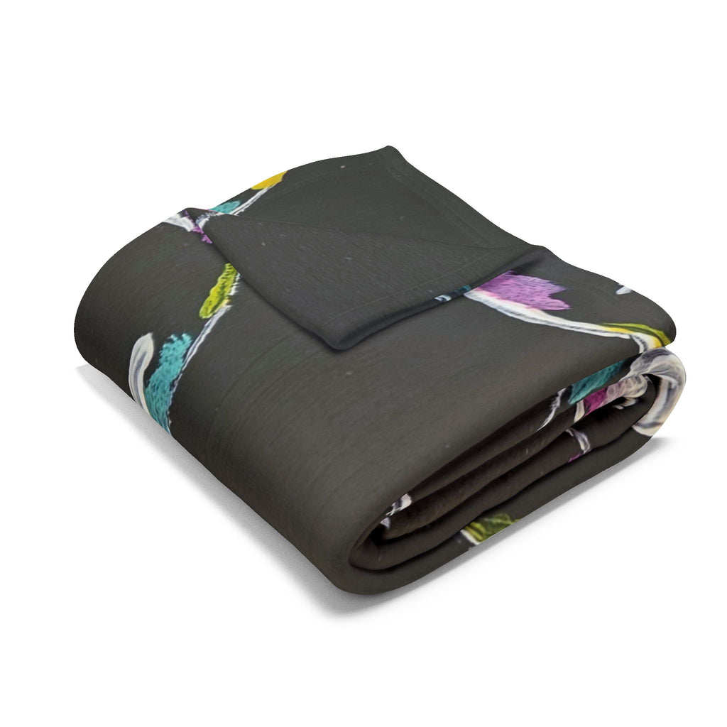 Folded fleece throw blanket, dark with colorful bubble/planet design and star accents