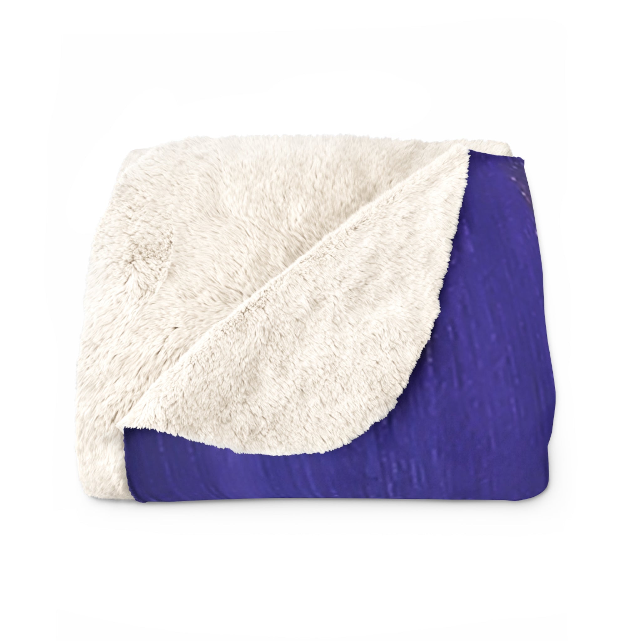 Sherpa blanket with white fuzzy sherpa top and solid purple underside