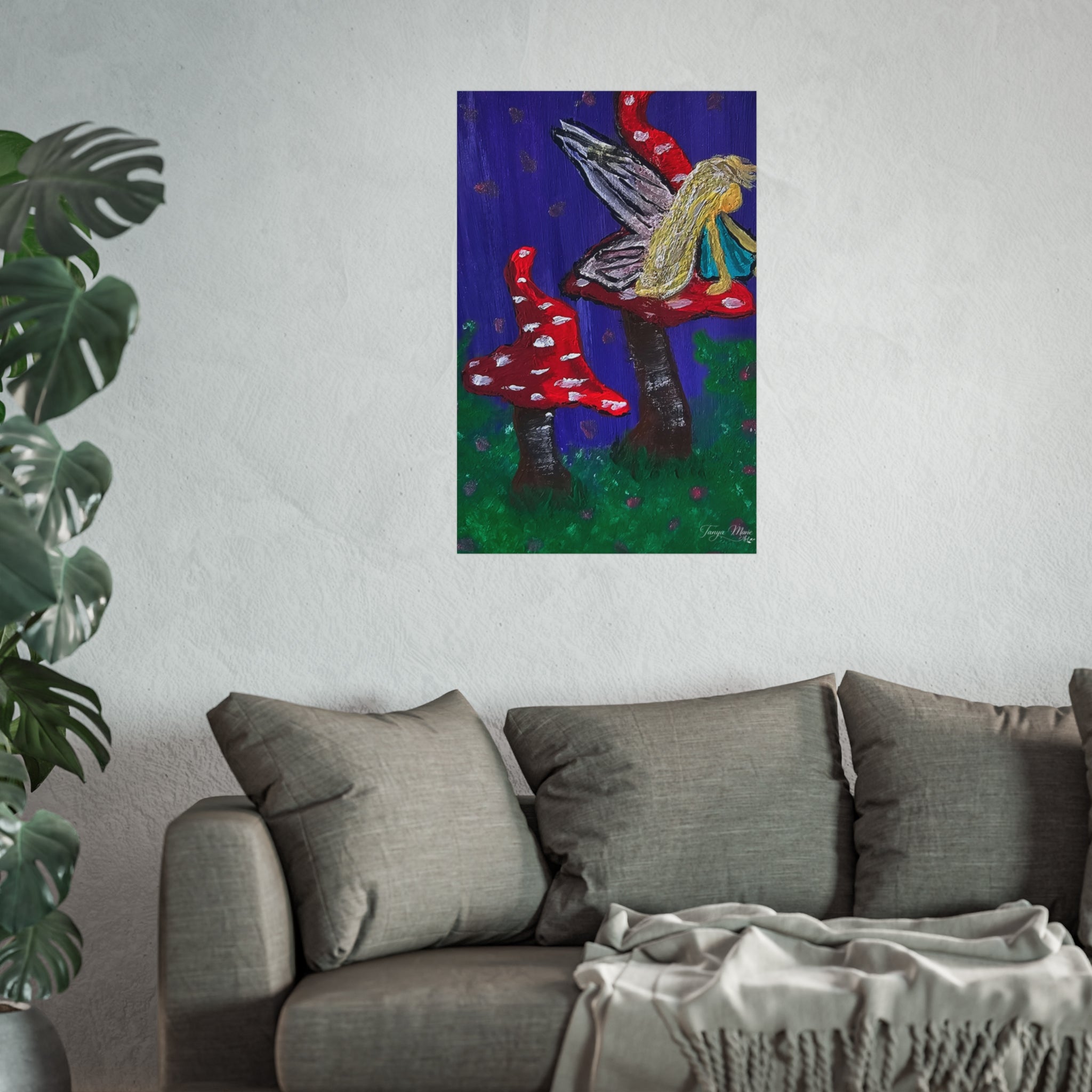 Matte fine art poster showing a blonde fairy perched on red spotted mushrooms and green ground