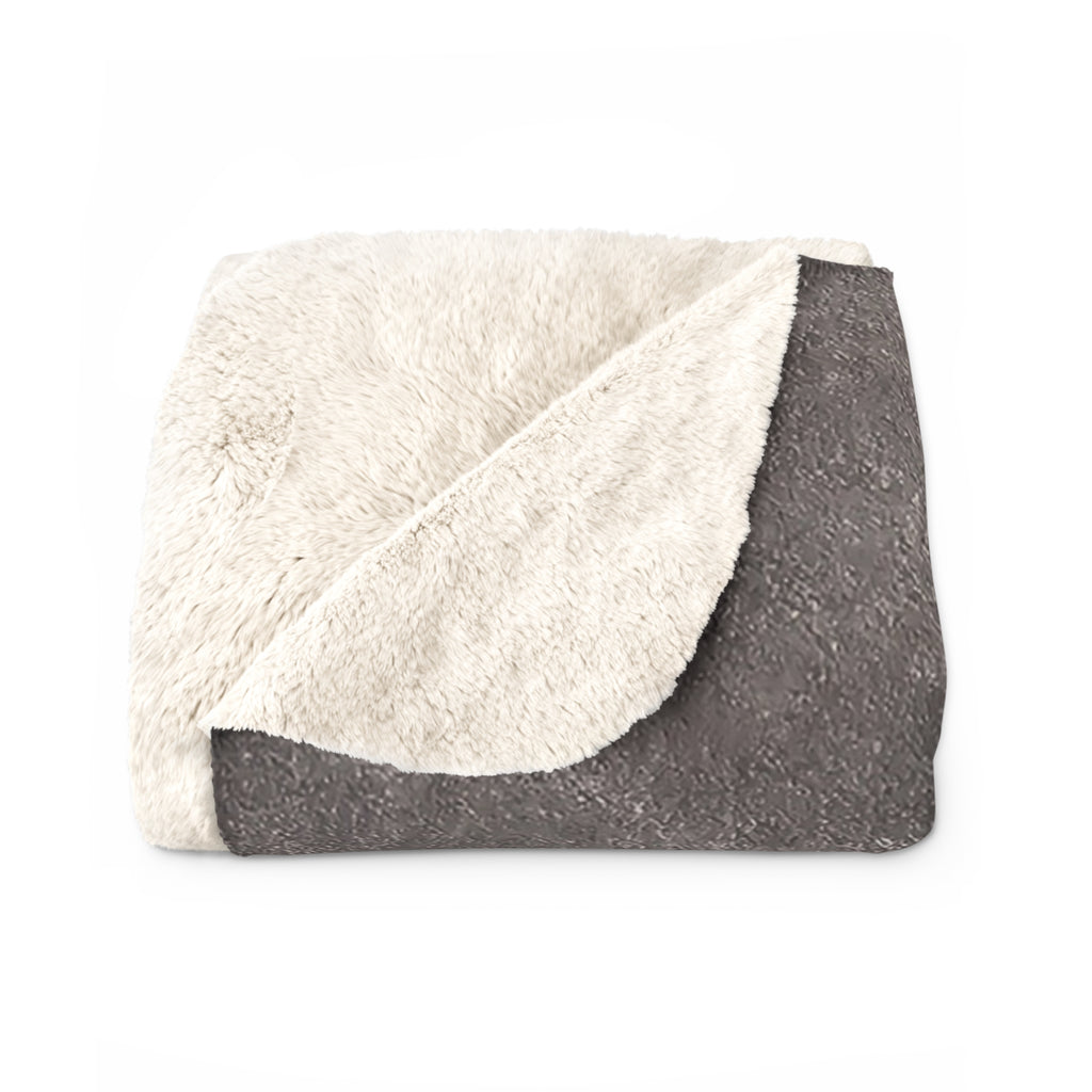 Sherpa-style blanket with cream sherpa top and dark gray guitar motif with rounded sound hole