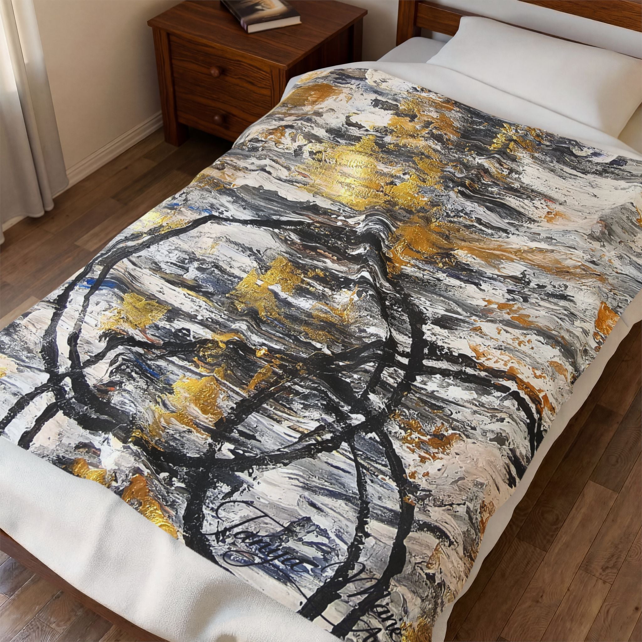 Velveteen plush blanket with abstract gold and charcoal circle design