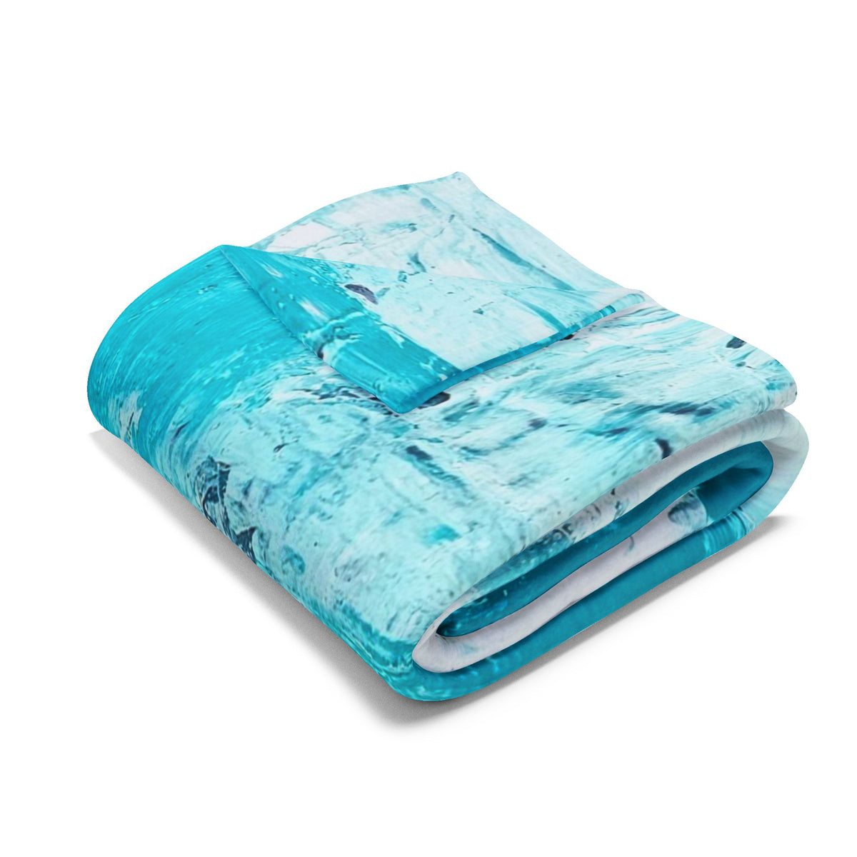 Turquoise abstract fleece blanket folded, smooth fleece with blue-white artwork.