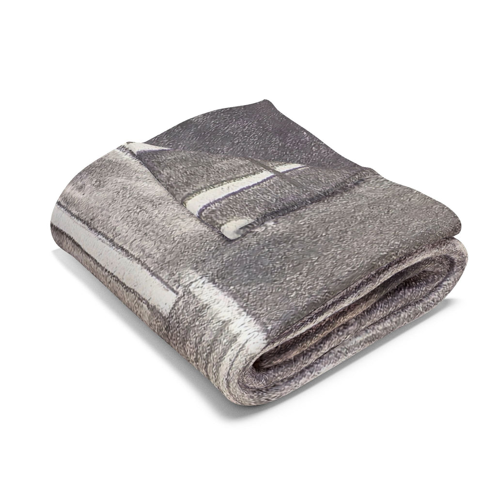 Folded gray fleece blanket with acoustic guitar stripe and soundhole design