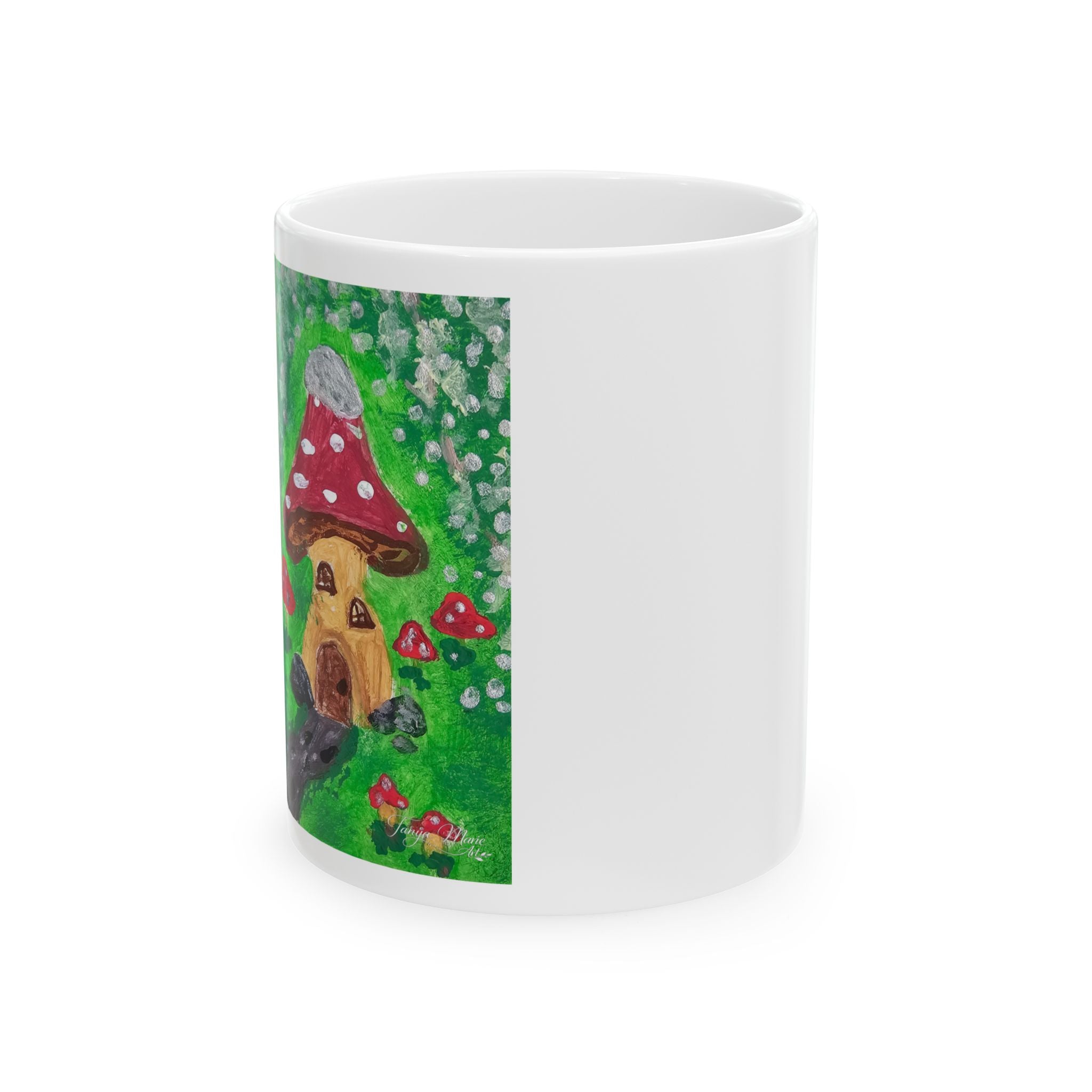 White ceramic mug with colorful mushroom cottage illustration panel on side