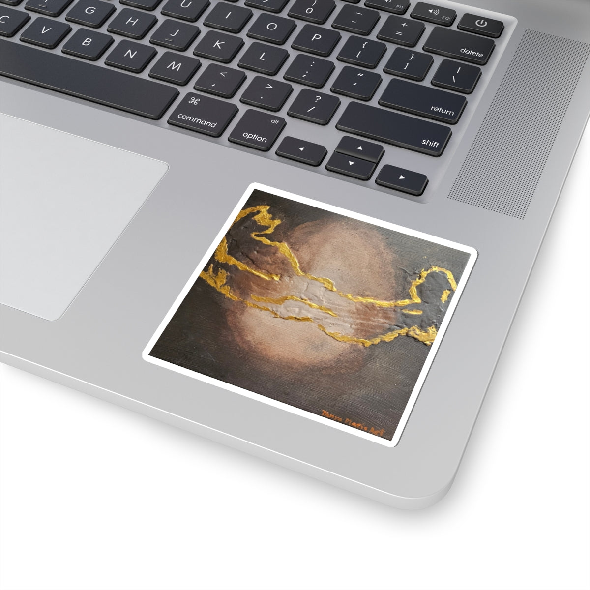 Abstract vinyl sticker with dark brown texture and gold vein-like lines in a white border