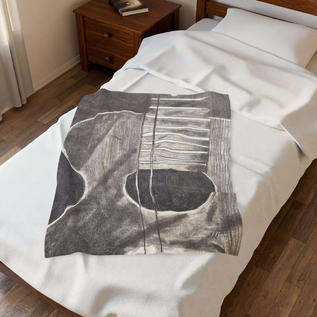 Plush blanket with acoustic guitar sketch graphic in dark gray on white