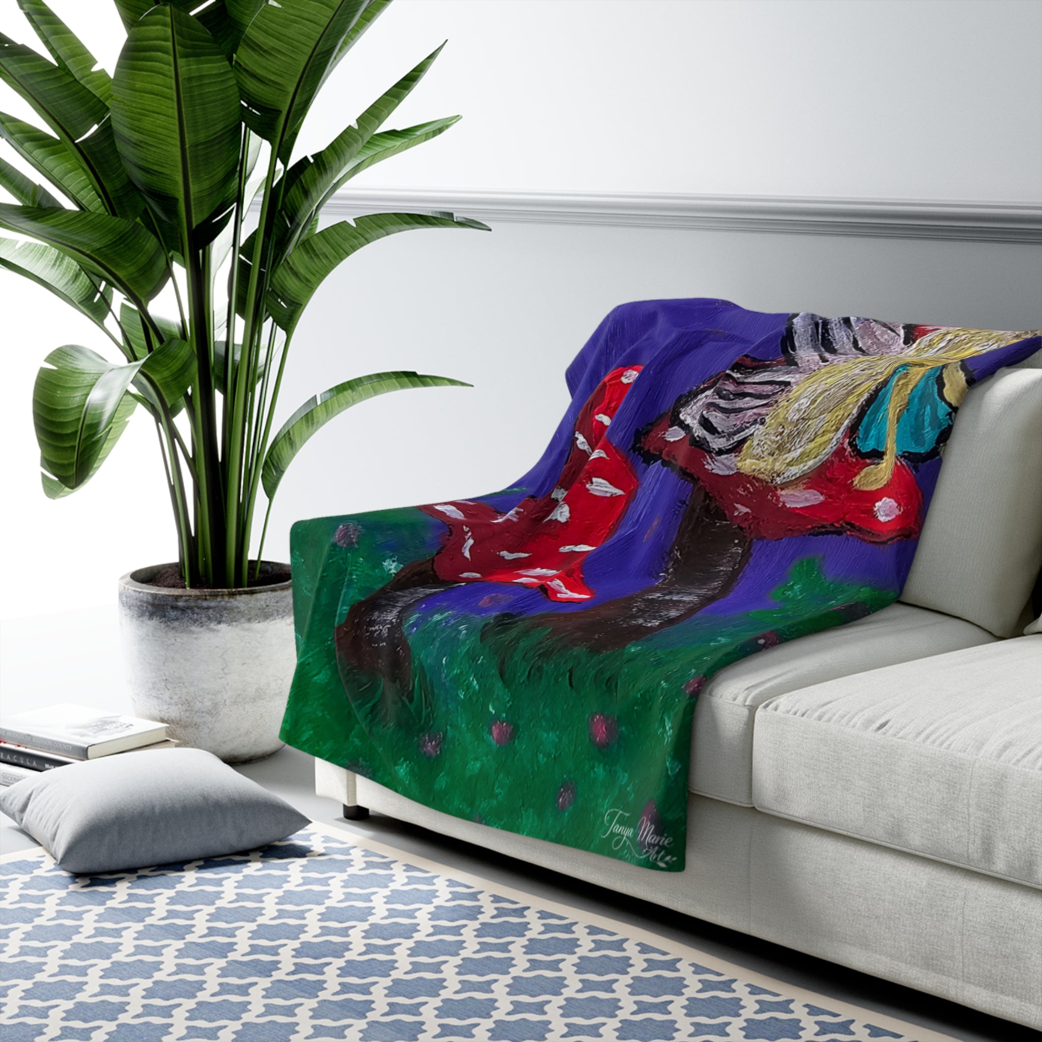Sherpa fleece throw blanket with whimsical mushroom tree artwork on blue and green