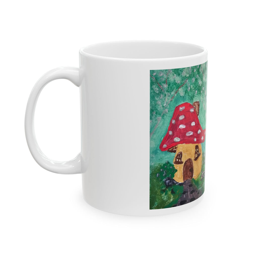White ceramic coffee mug with red mushroom cottage artwork on front side