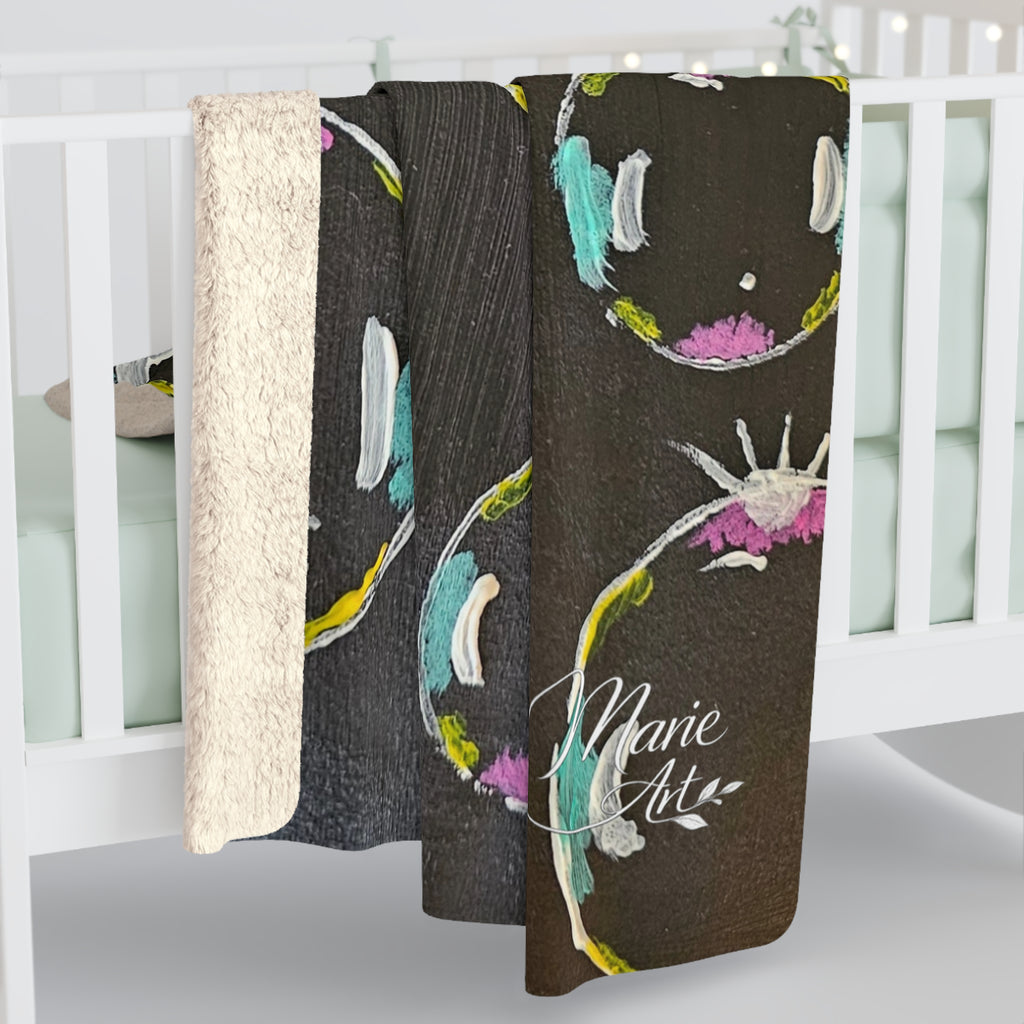 Sherpa fleece blanket hanging, white sherpa side with dark gray bubble circle print and stars