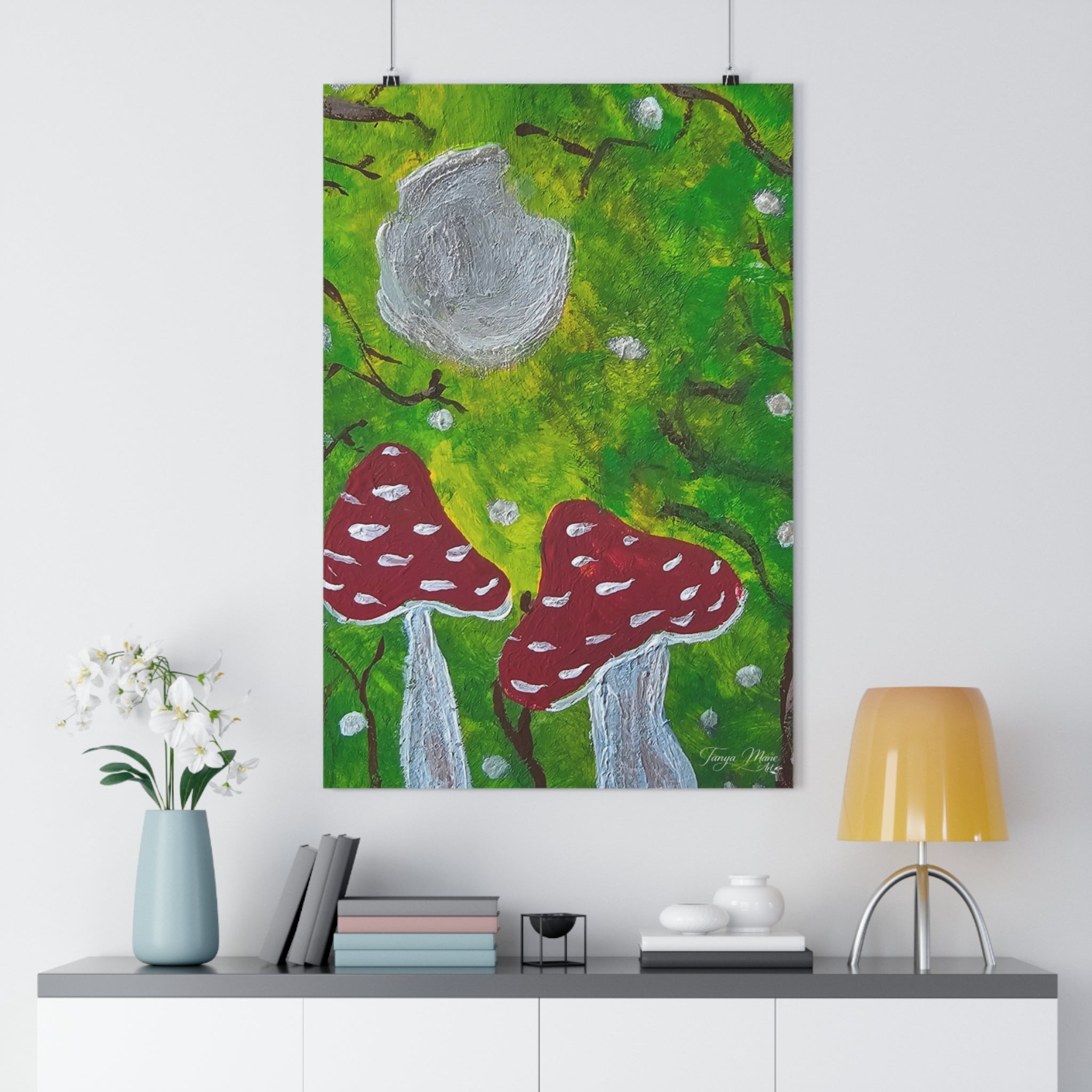 Hanging wall art print featuring green forest, gray moon circle, and red mushrooms with dots