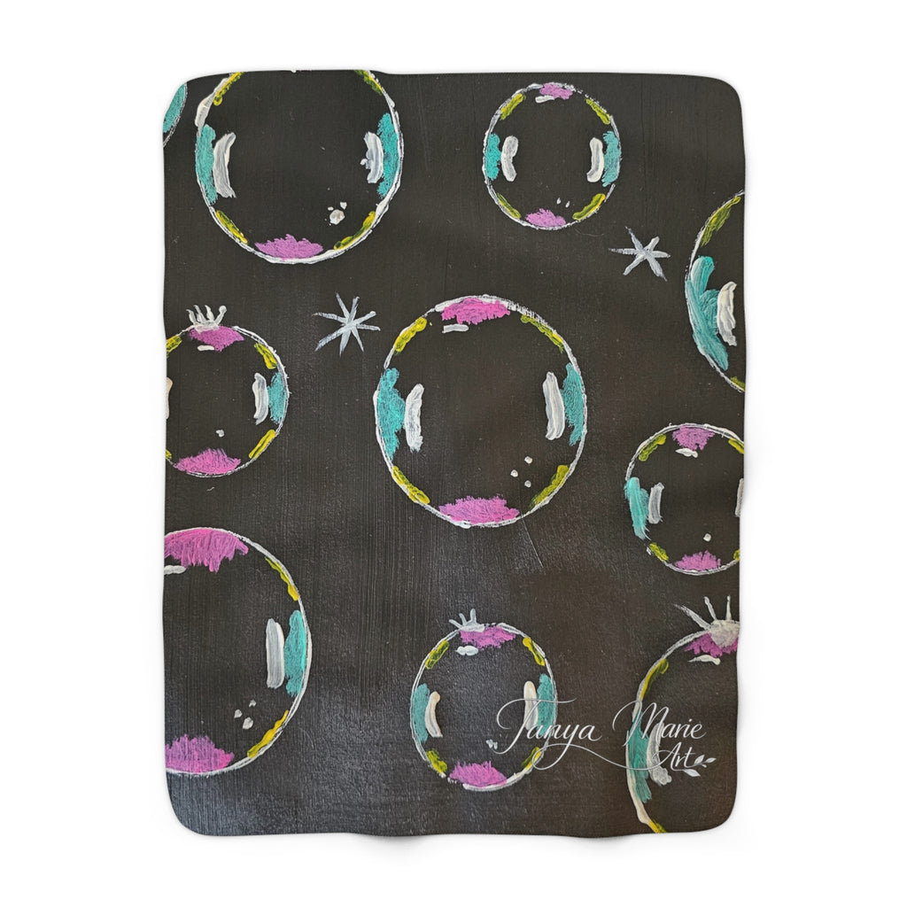 Sherpa fleece blanket, dark gray with multicolor bubble circles and a white script logo