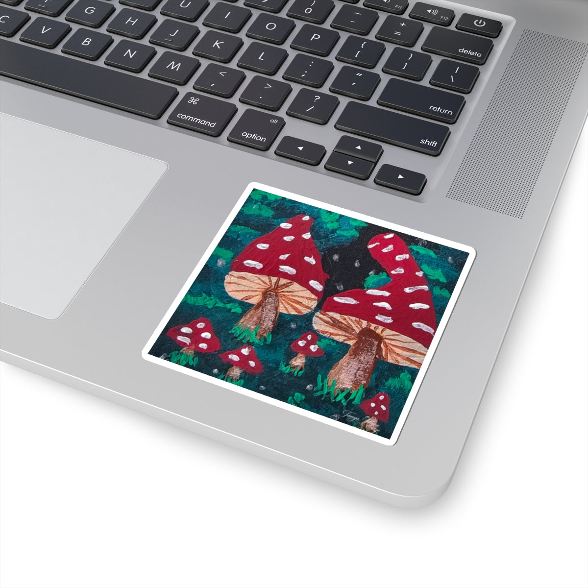Kiss-cut sticker with red spotted mushrooms on dark green forest background