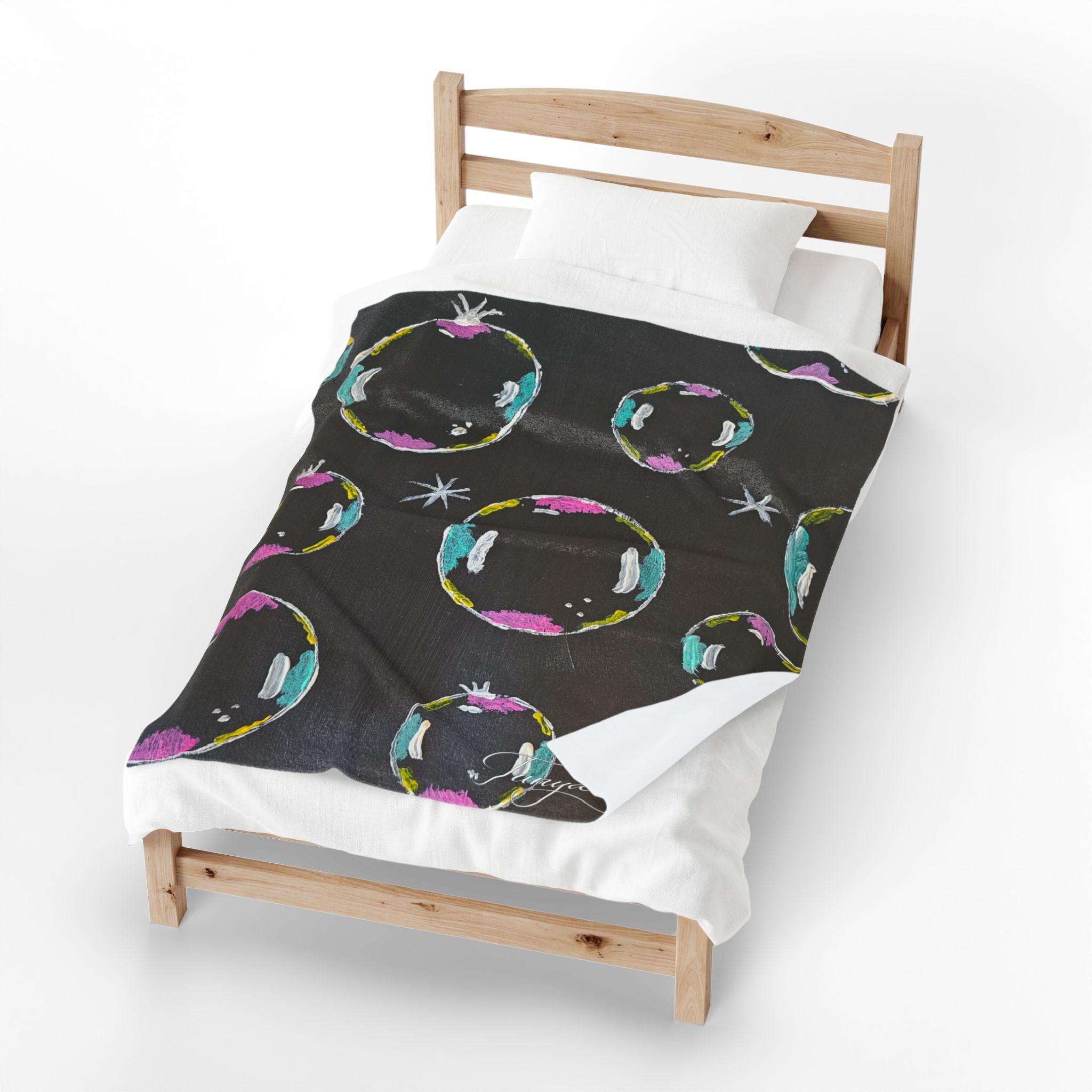 Black velveteen plush blanket with colorful bubble swirl pattern