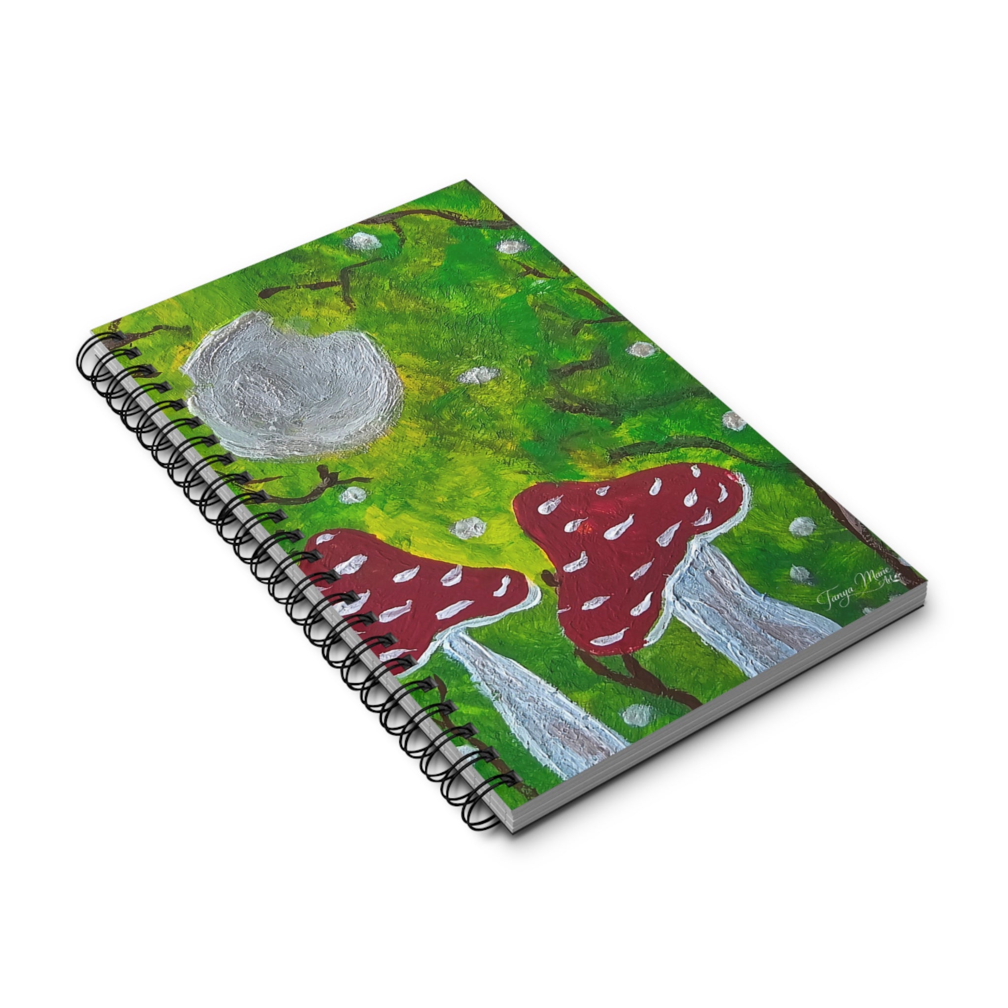 Spiral nature journal with illustrated green cover and red mushroom graphic