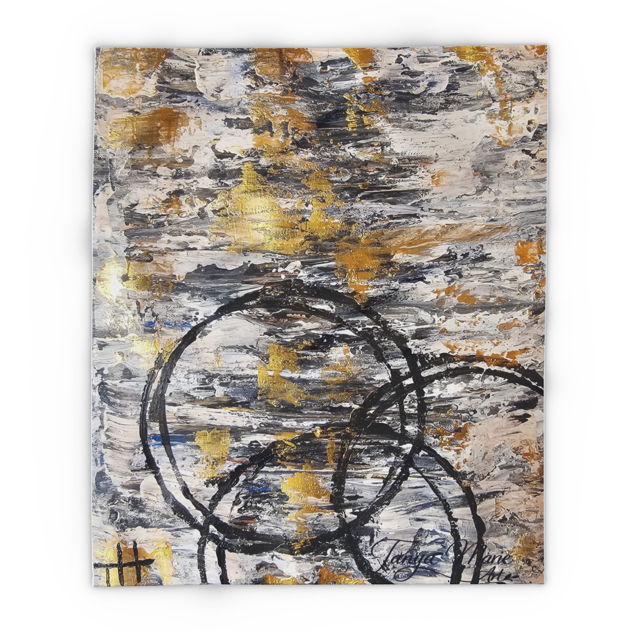 Abstract fleece blanket with grey, gold, and black circle pattern, flat square view