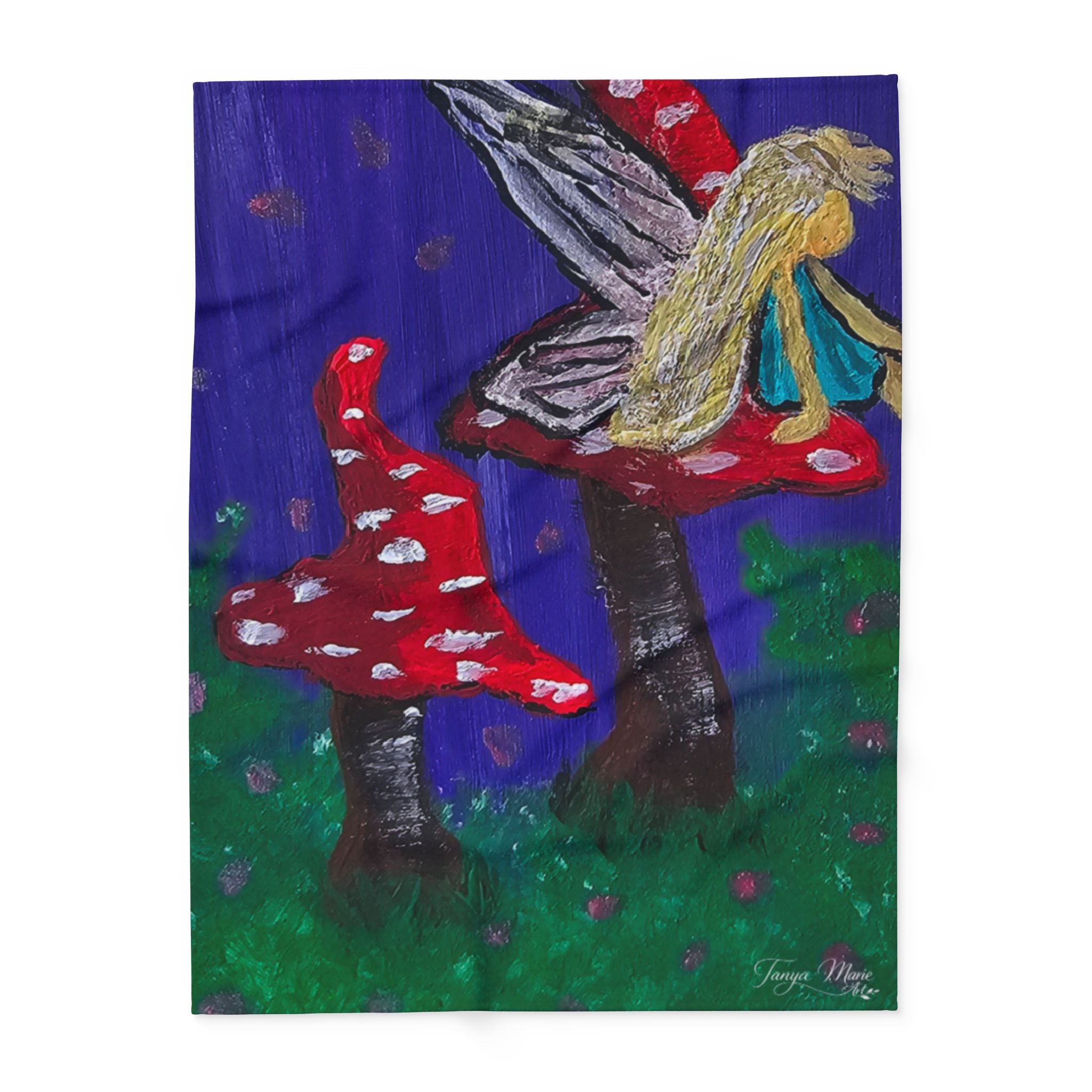 Fleece blanket artwork panel: blonde fairy figure with wings beside red mushroom tree