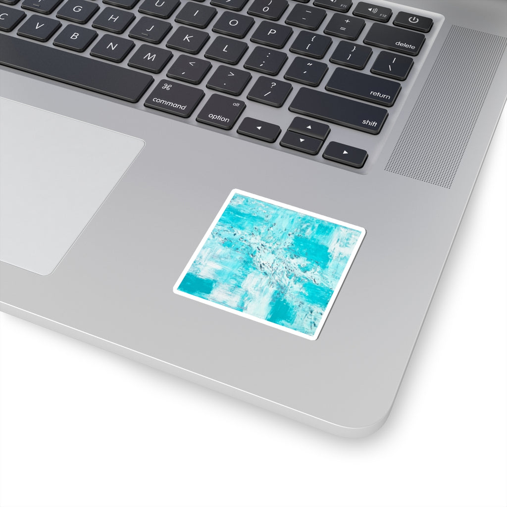 Teal abstract art sticker with white border on laptop