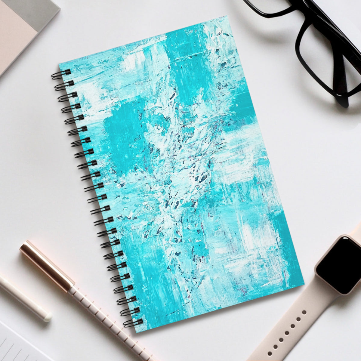 Turquoise abstract spiral journal with teal abstract cover and black spiral binding