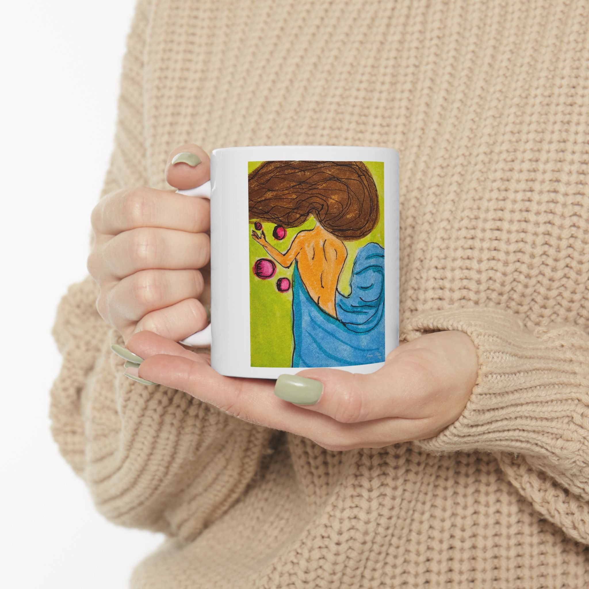 White ceramic mug with colorful witchy face and crown artwork on front