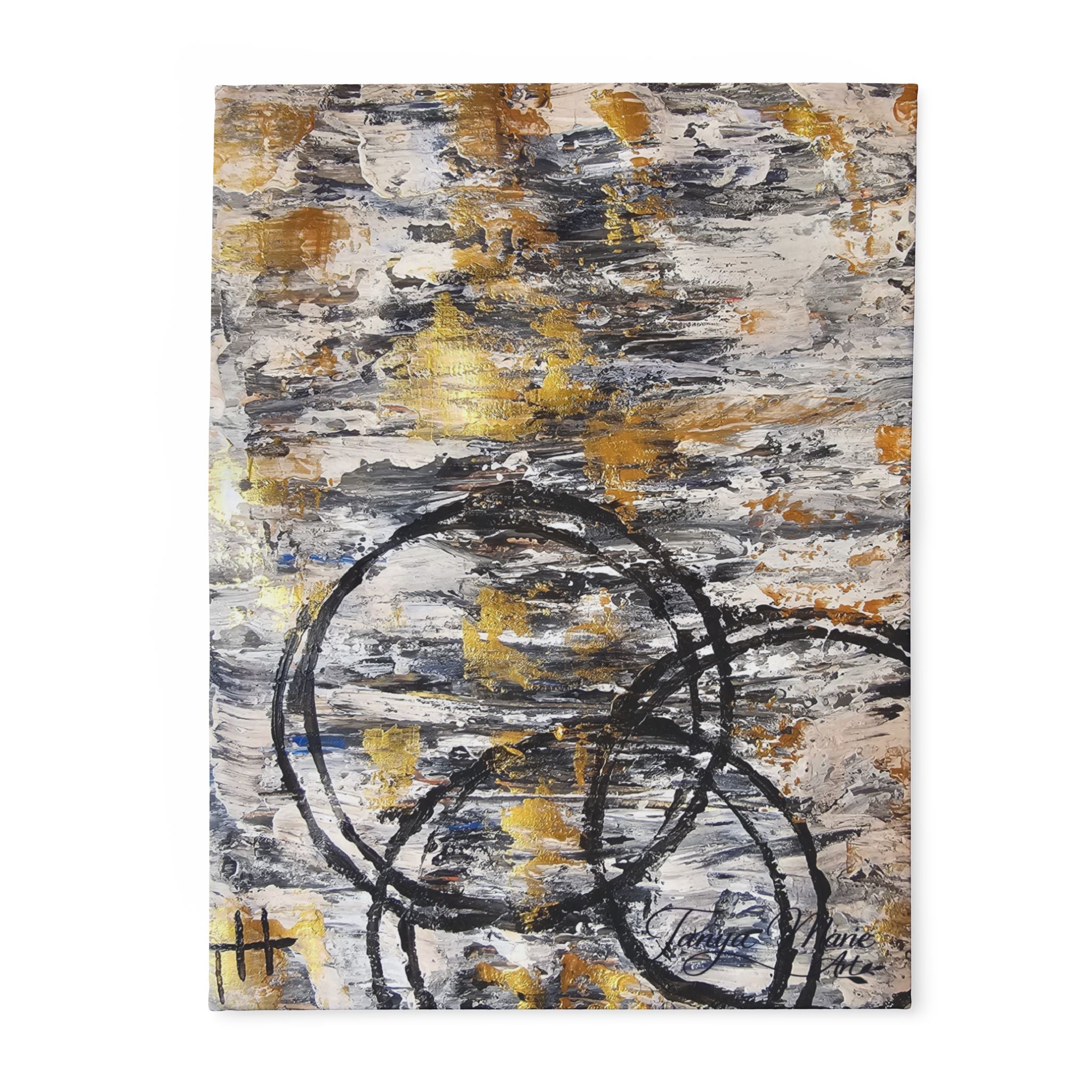 Abstract fleece blanket with grey and gold brush textures and bold black circle design