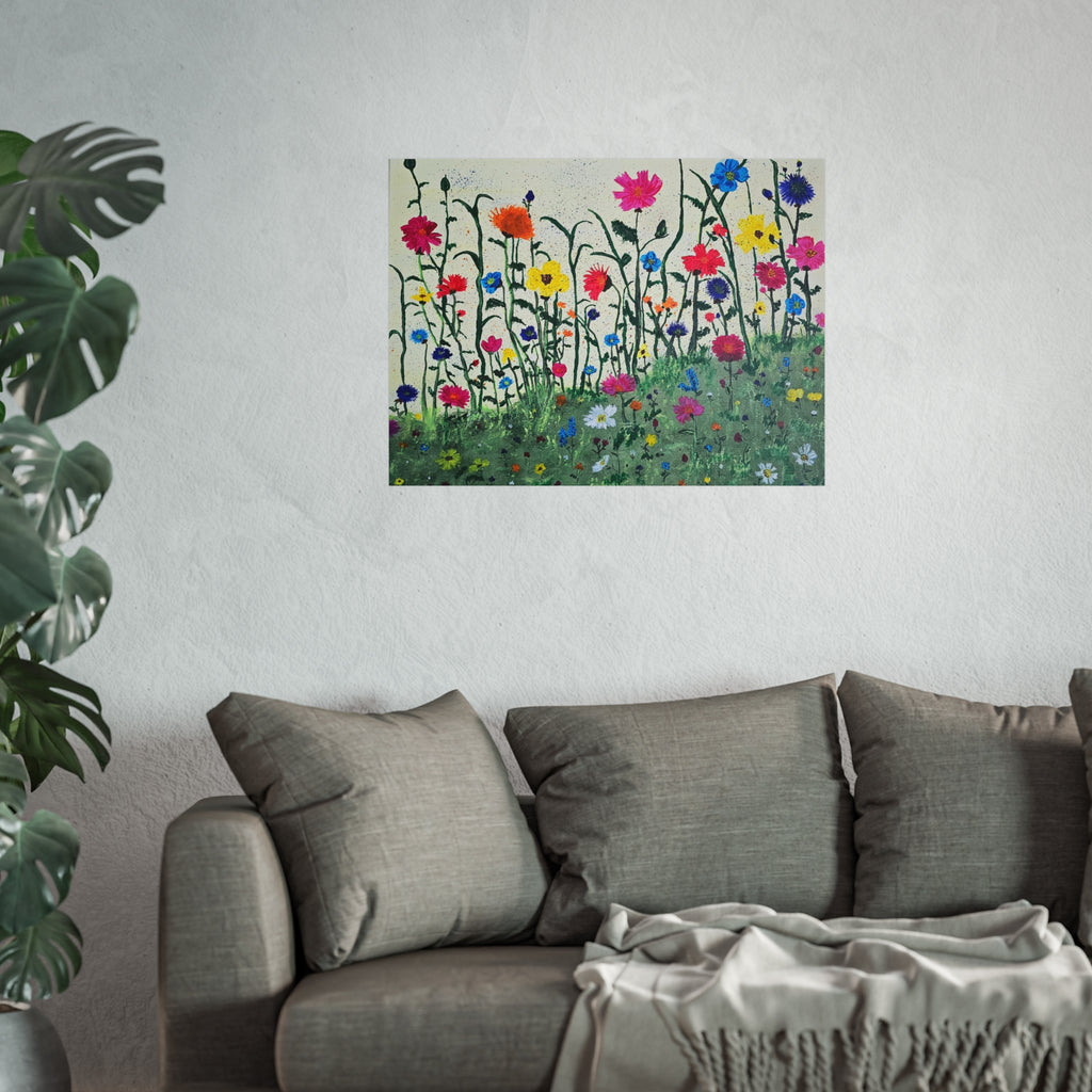 Matte wildflower art poster on wall above gray sofa with folded throw blanket