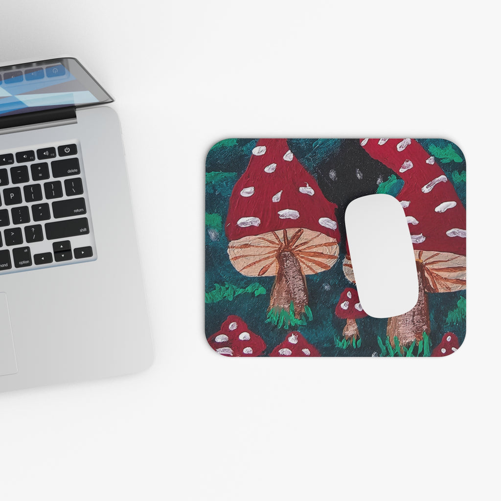 Rounded rectangle mushroom mouse pad with red toadstools, green foliage, dark background