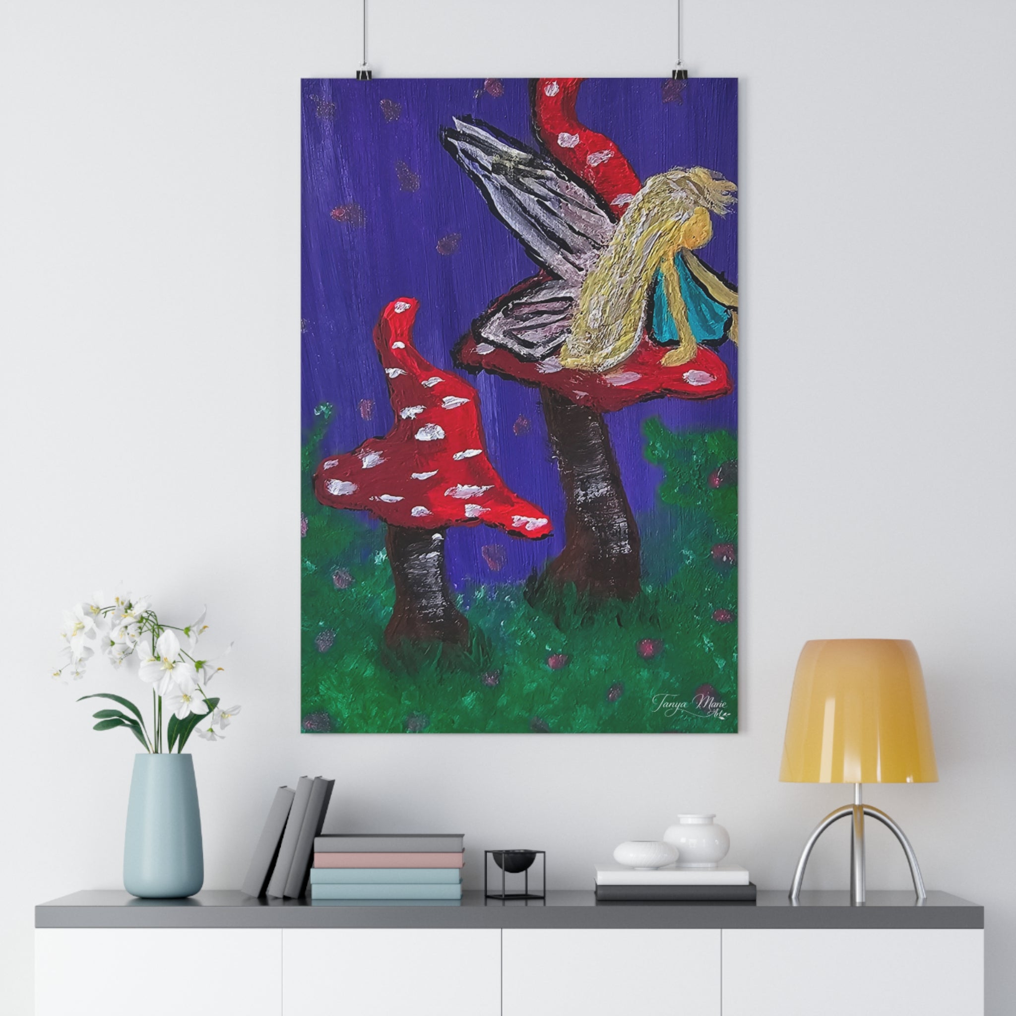 Mushroom fairy art print with red spotted toadstools, green ground, and blonde winged fairy