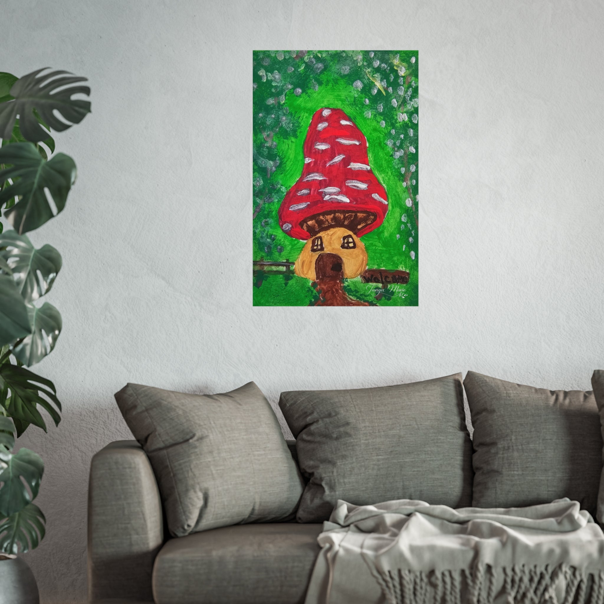 Fine art poster centered on wall: red mushroom cap house with brown windows and green garden