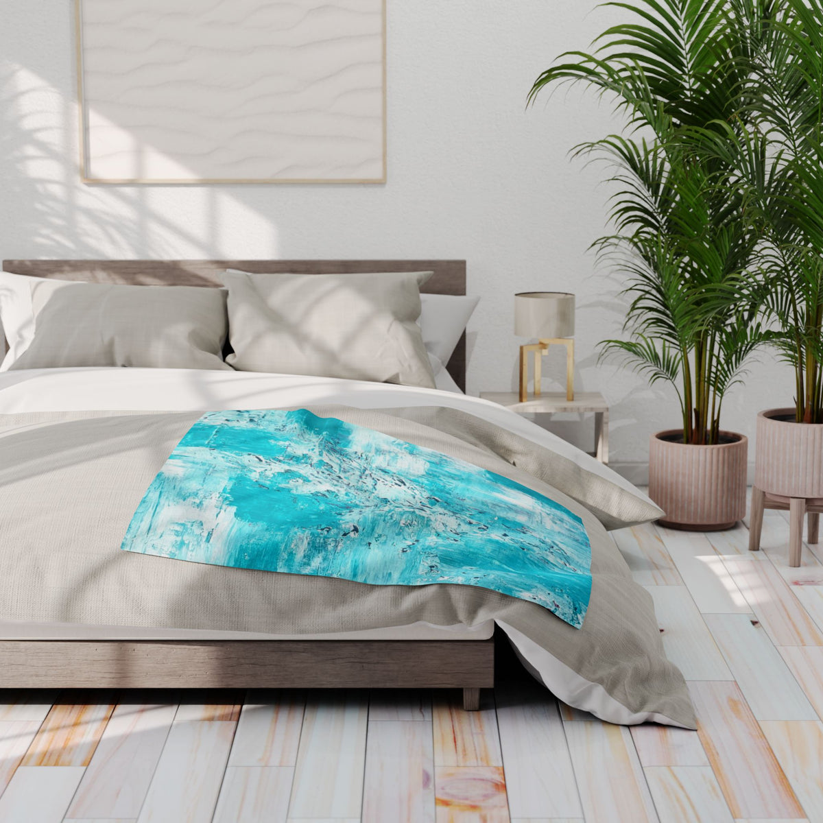 Turquoise abstract fleece blanket across bed, splash-streak design