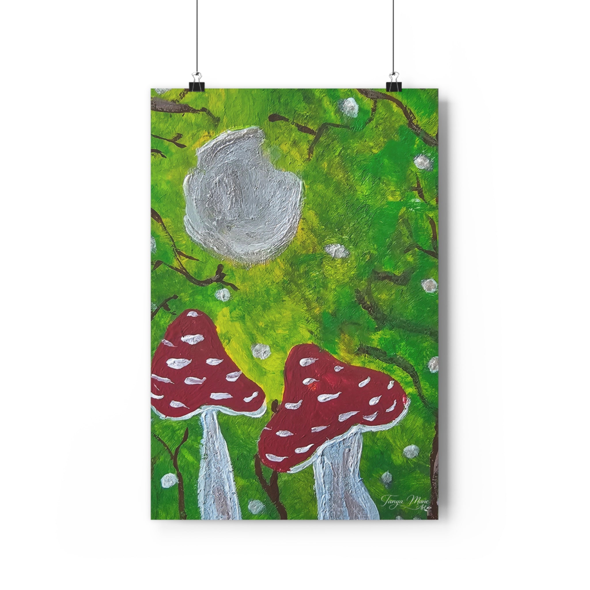Hanging wall art print with green foliage, large gray moon, and red mushrooms on stems