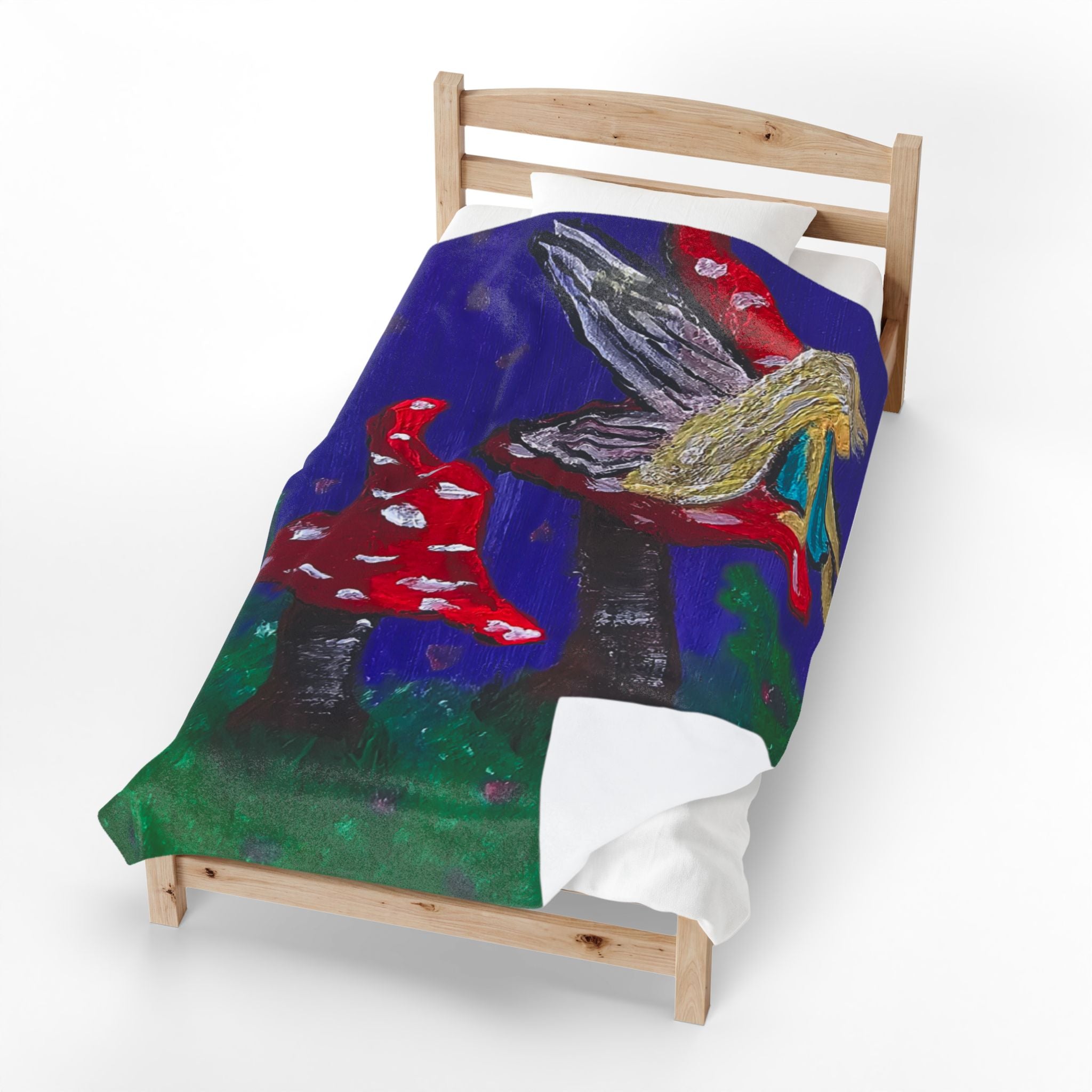 Plush velveteen blanket with fairy wings and red toadstool motifs