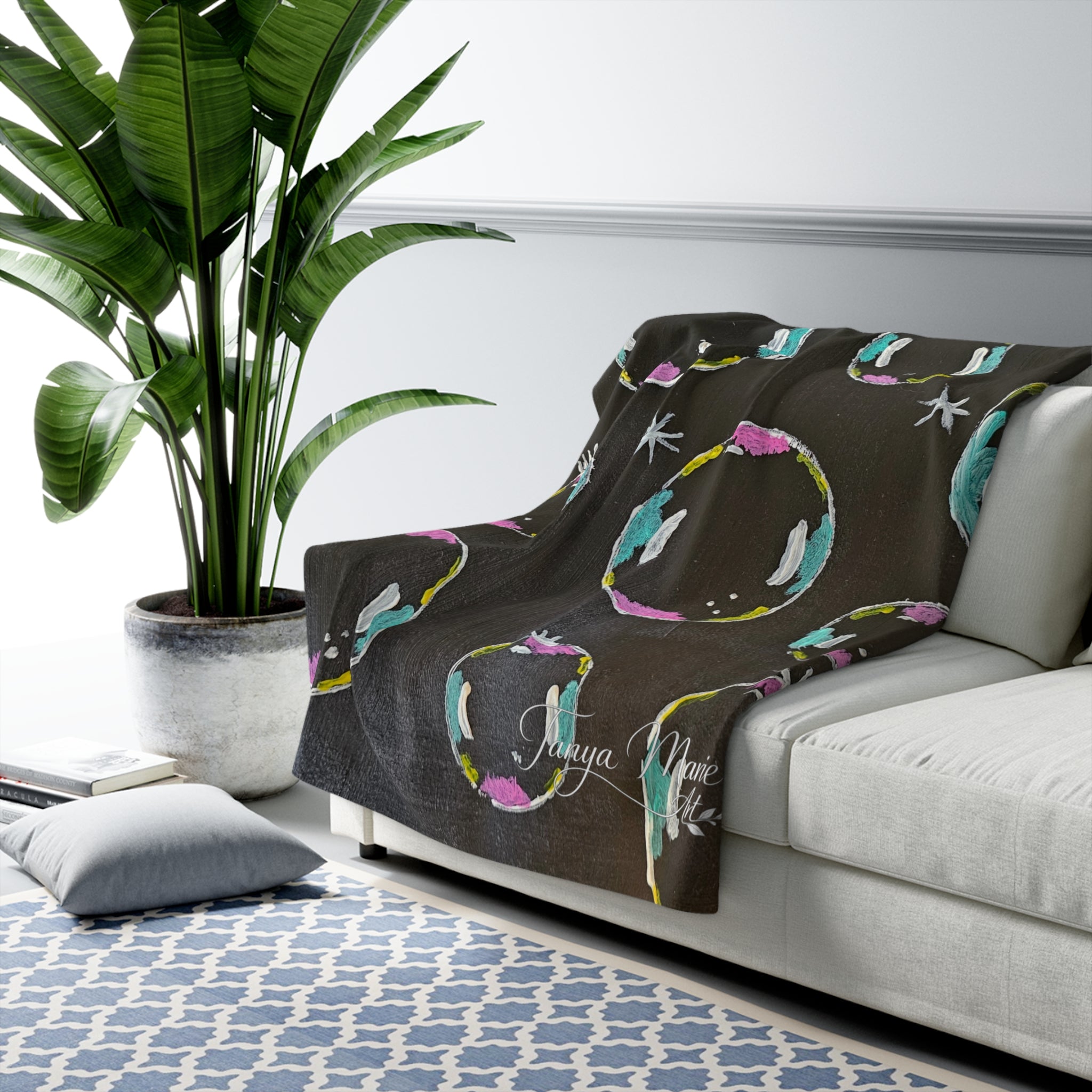 Sherpa fleece blanket with dark gray background and colorful bubble circle pattern
