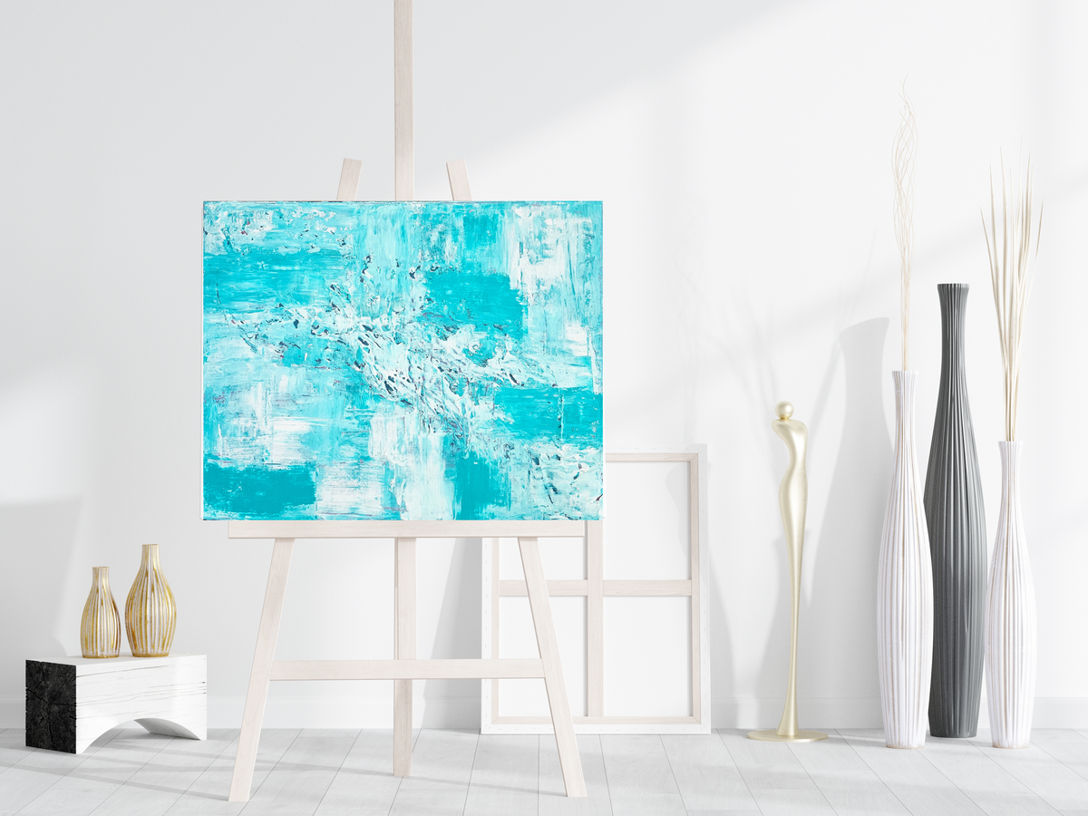 Teal and white textured acrylic abstract painting on wooden easel, rectangular canvas