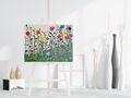 Wildflowers acrylic original painting on easel with colorful flowers over green field